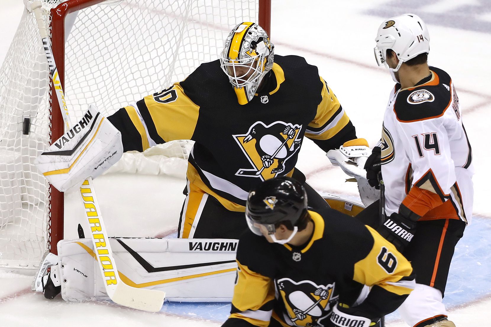 Pittsburgh Penguins goaltender Matt Murray (30) blocks a shot during the first period of the team's NHL hockey game against the Anaheim Ducks in Pittsburgh, Thursday, Oct. 10, 2019. (AP Photo/Gene J. Puskar)