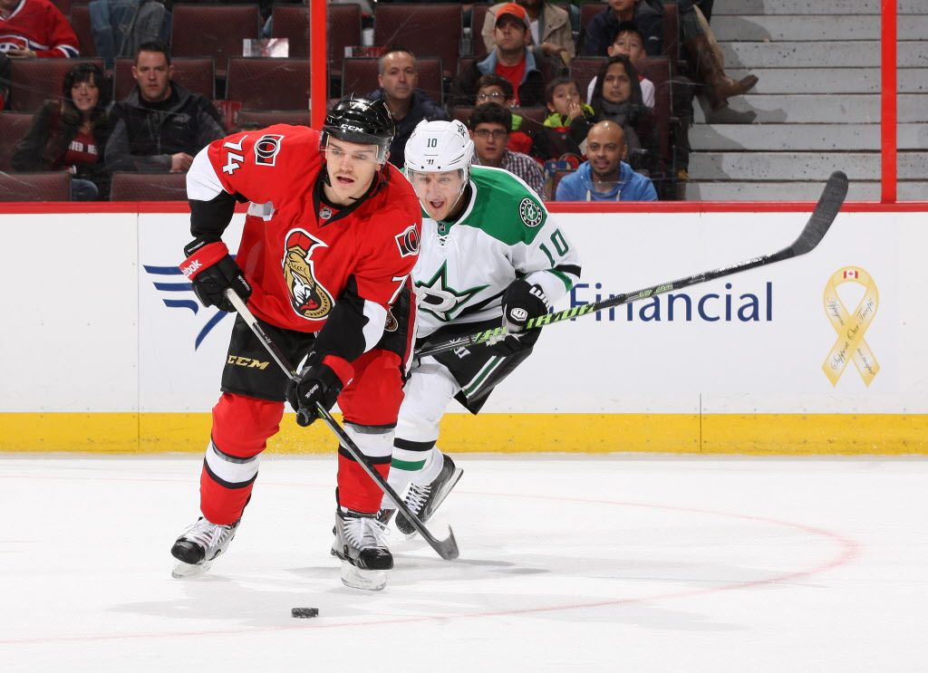 OTTAWA, ON - NOVEMBER 3: Mark Borowiecki #74 of the Ottawa Senators skates with the puck against Shawn Horcoff #10 of the Dallas Stars during an NHL game at Canadian Tire Centre on November 3, 2013 in Ottawa, Ontario, Canada. (Photo by Jana Chytilova/Freestyle Photography/Getty Images)