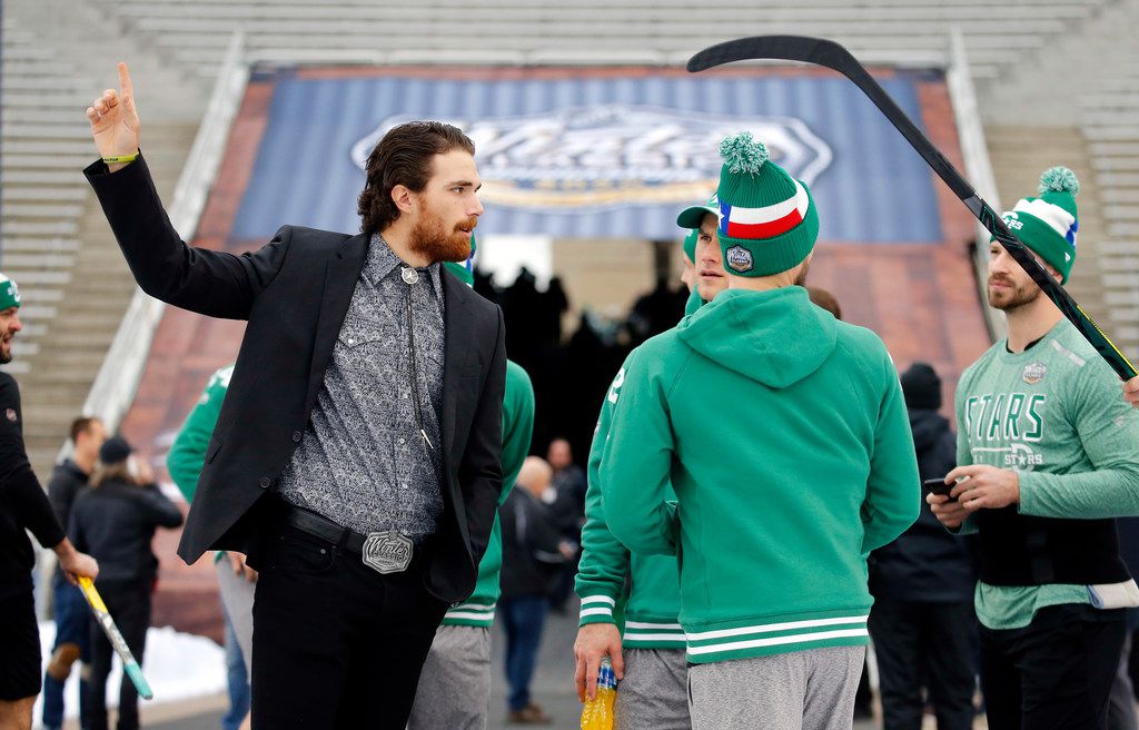 Dallas Stars injured player Stephen Johns (left) visits with his teammates as they get acclimated to the cold weather before the NHL Winter Classic hockey game against the Nashville Predators at the Cotton Bowl in Dallas, Wednesday, January 1, 2019. (Tom Fox/The Dallas Morning News)