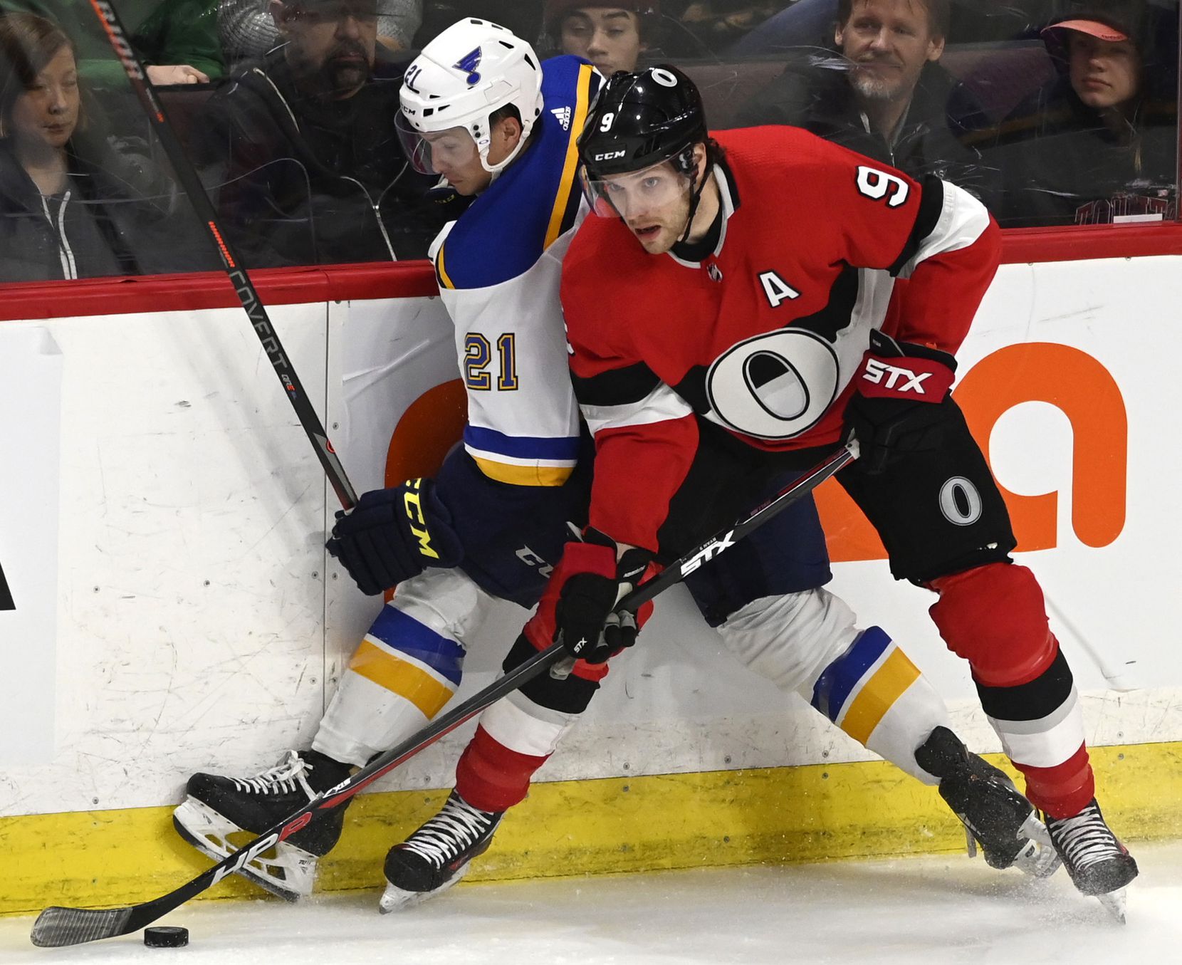 FILE - In this March 14, 2019, file photo, Ottawa Senators right wing Bobby Ryan (9) drives the puck along the boards with St. Louis Blues center Tyler Bozak (21) during second-period NHL hockey game action in Ottawa, Ontario. Ryan has been named the Bill Masterton Trophy winner for publicly sharing his battle with alcohol issues. The 33-year-old Ryan missed more than two months after entering the NHL/NHLPA players assistance program on Nov. 20, 2019. (Justin Tang/The Canadian Press via AP, File)