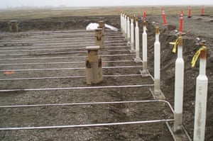 Thermosiphons installed at the Nikaitchuq oilfield on Alaska’s North Slope, where they cool the ground and keep permafrost from thawing beneath a warehouse.