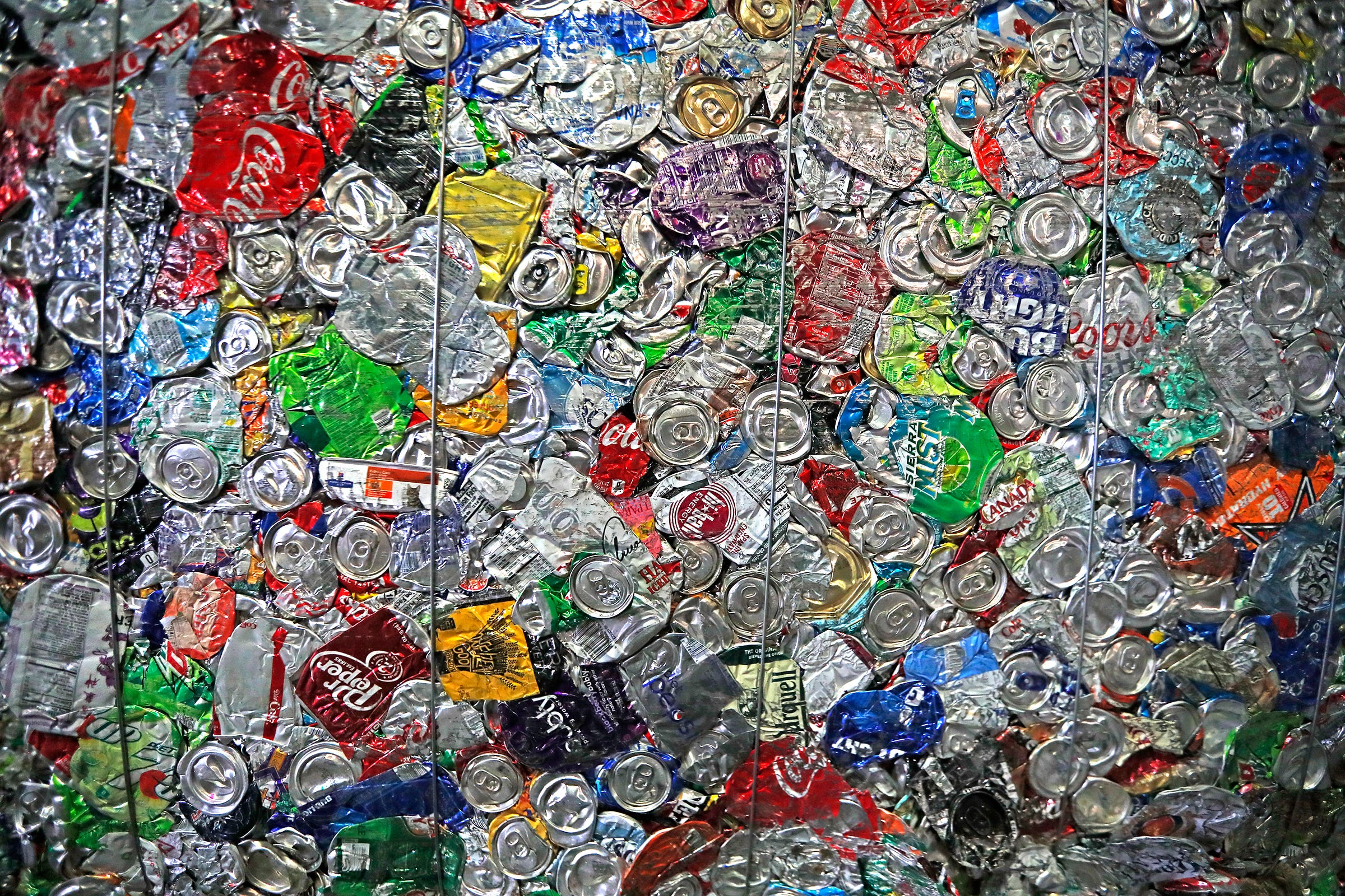 Flattened cans are bound together at the end of the recycling process at the Ray's Indianapolis Recycling Facility, part of Ray's Trash Service, Thursday, Sept. 3, 2020. 