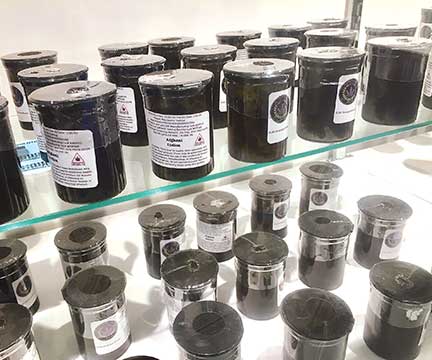 Eighth-ounce cannisters of cannabis at Sweet Relief in Northport after the shop recently restocked
