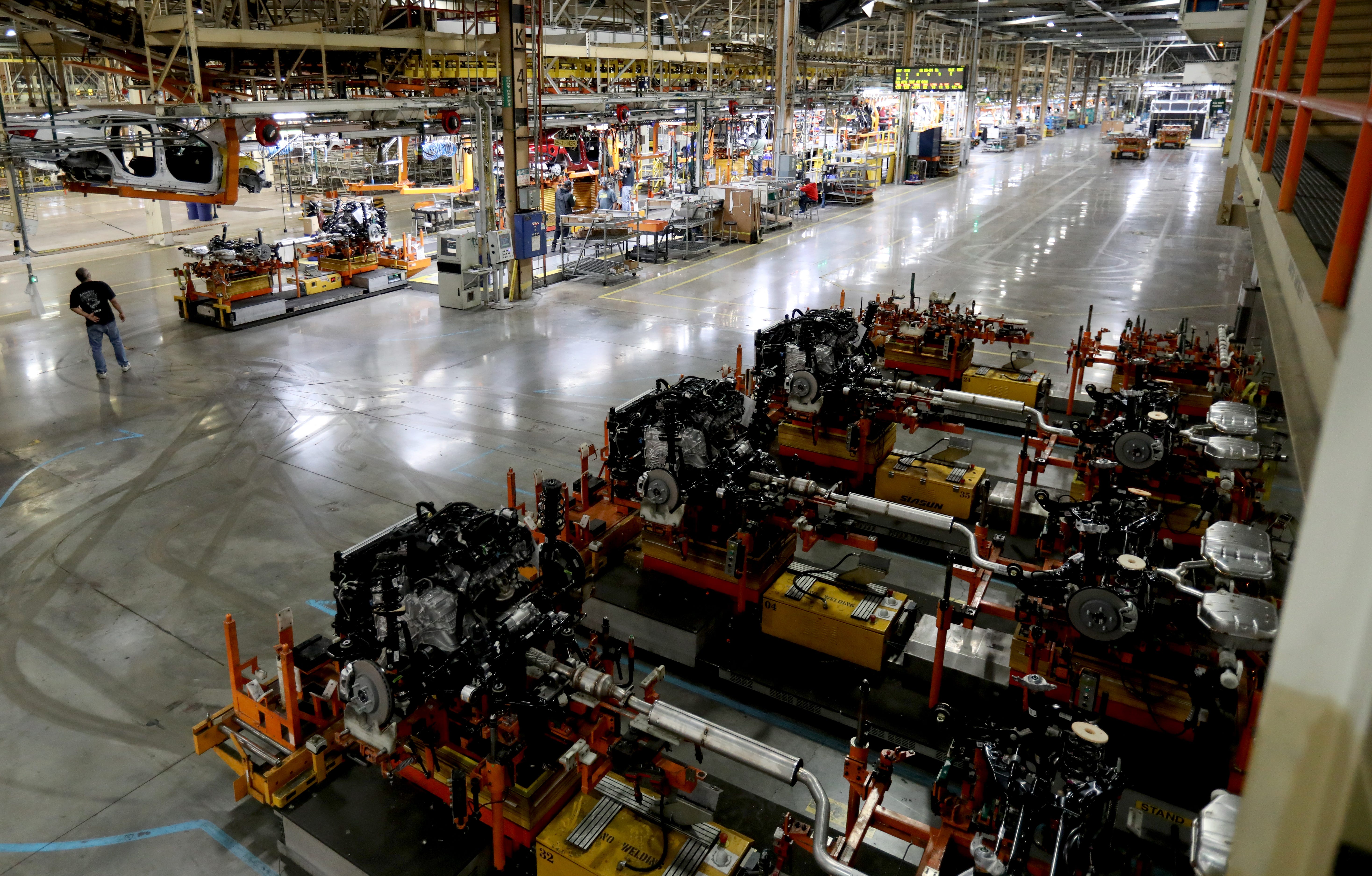 Robots with the undercarriage containing the engine, transmission and exhaust wait in line for the command to move towards the body and frame of 2020 Chevrolet Impala's on Tuesday, February 18, 2020 inside the GM Detroit-Hamtramck Assembly plant. The car is nearing its end of production as the plant is being retooled and fitted for electric vehicles. 