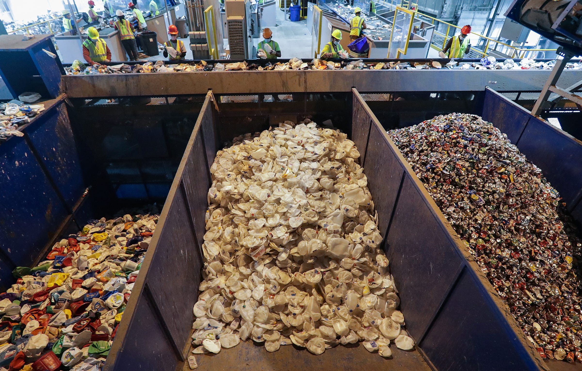 Items are sorted by material into large silos near the end of the sorting process at the Republic Services facility in Indianapolis on Wednesday, Sept. 9, 2020. 
