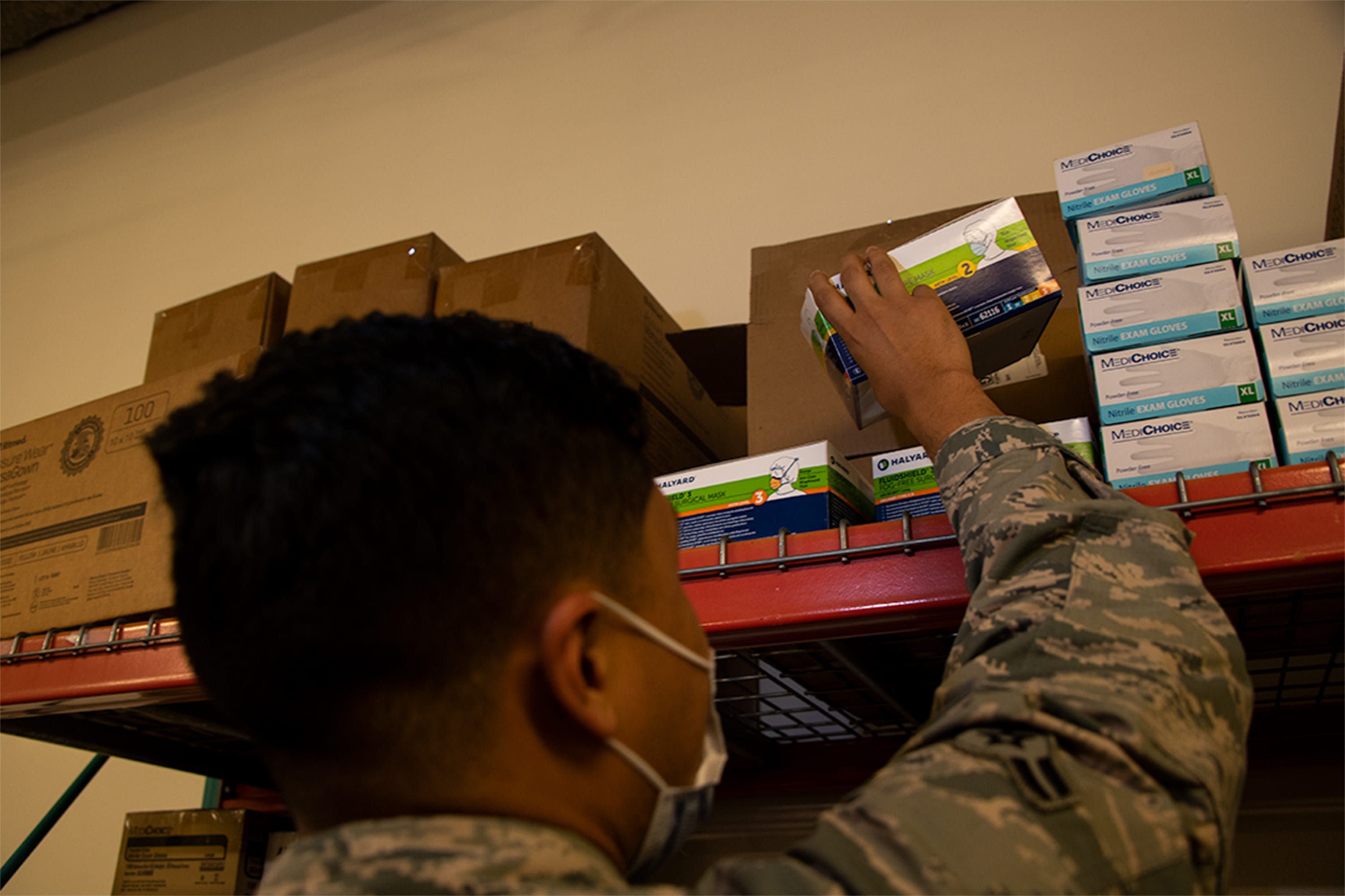 Airman 1st Class Yobanni Calderon, 42nd Medical Materiel professional, restocks personal protection equipment at the 42 MDG, November, 6, 2020. Calderon ensures availability of PPE for all MDG staff. The efforts of Calderon permit the MDG mission to continue during the current COVID-19 environment.