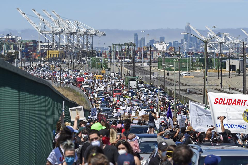 19 Jun 2020: Thousands march outside the Port of Oakland during a Black Live Matter march on the holiday celebrating the end of slavery. 29 ports along the West Coast of the US were closed for the rallies across the country.