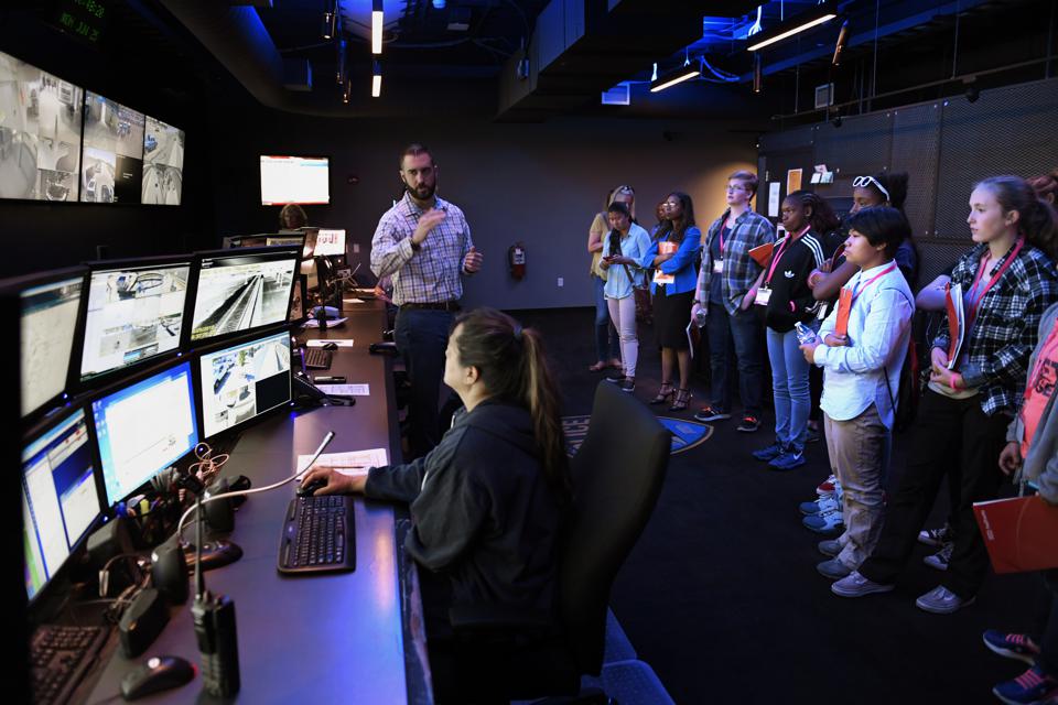 DENVER, CO - JUNE 25: Mike Christman manager of public communications for RTD explaining the workings of the RTD control center video monitoring system during the US Department of Transportation Career Days for Girls June 25, 2018 in Denver, Colorado. 