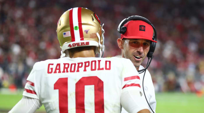 San Francisco 49ers quarterback Jimmy Garoppolo (10) with head coach Kyle Shanahan against the Arizona Cardinals at State Farm Stadium.