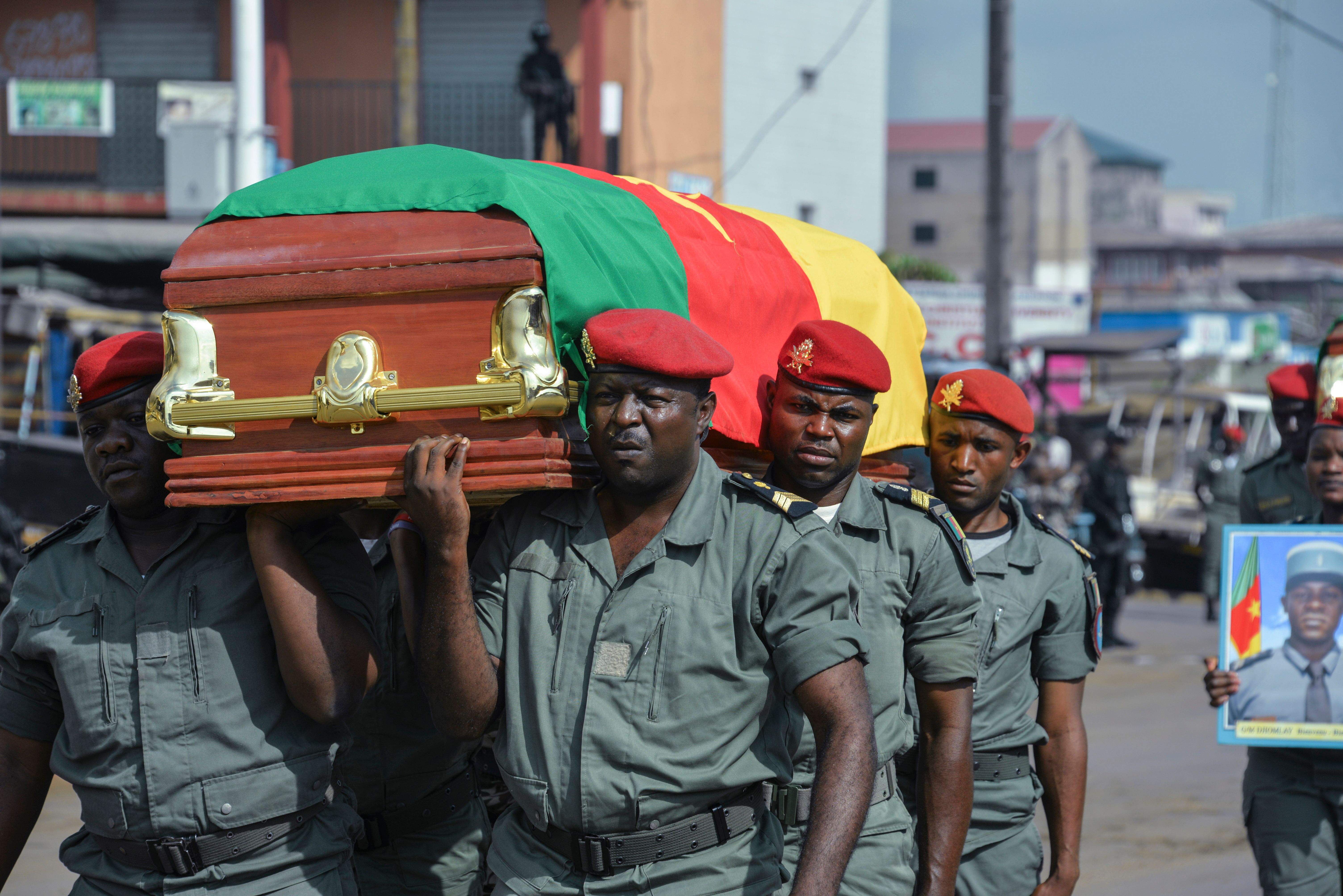 Soldiers carry the coffin of one of the four soldiers killed in the violence that erupted in the Northwest and Southwest regions of Cameroon in Bamenda on Nov. 17, 2017.