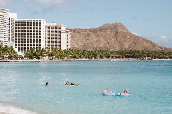 Waikiki beach is seeing far fewer tourists during the coronavirus pandemic.