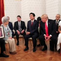 Prime Minister Shinzo Abe, U.S. President Donald Trump and first lady Melania Trump meet with family members of people abducted by North Korea in Tokyo in May 2019.  | REUTERS