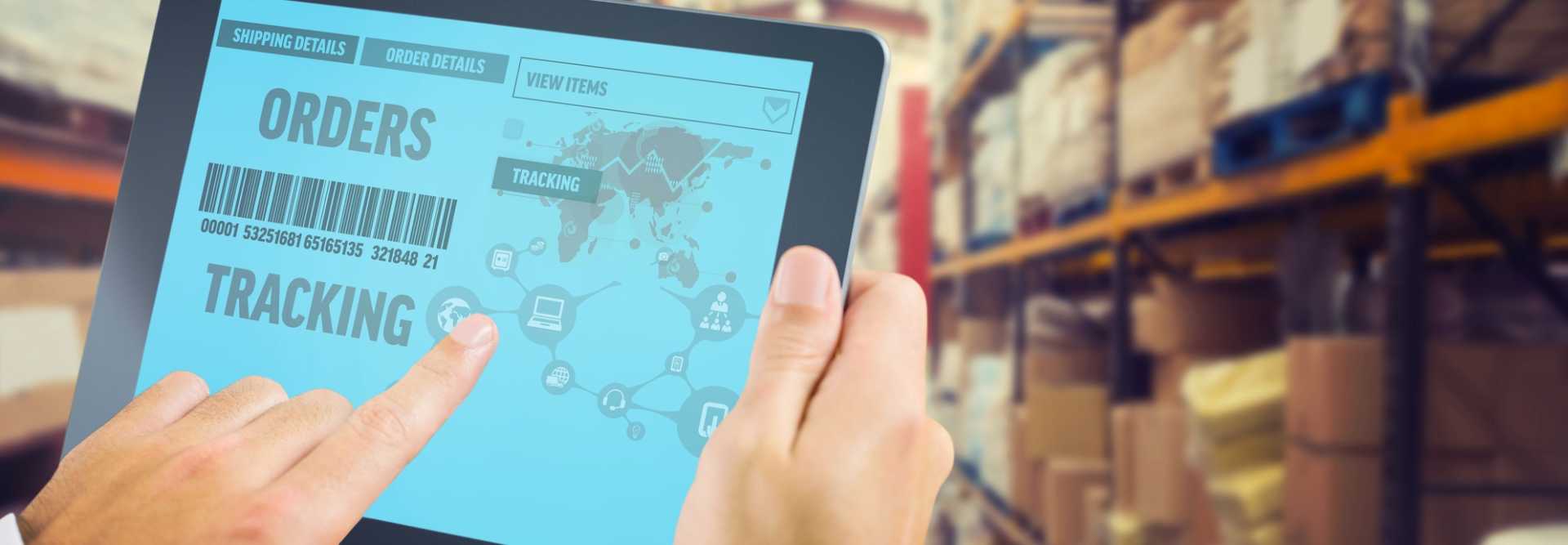 Manufacturing Planning - Man using tablet pc warehouse tracking asset supply chain -image courtesy of Depositphotos.