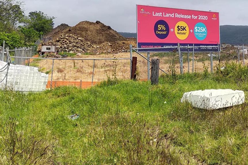 Broken waffle pods strewn across construction and park land.