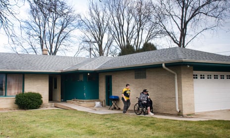 McFarlane outside his new home with his son.