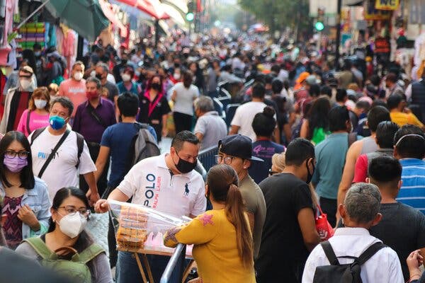 Despite warnings from officials about a surge in coronavirus cases and pleas for them to stay home during the Christmas holiday period, people filled a shopping area in Mexico City on Friday.