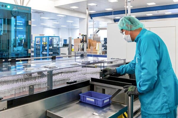 A Sanofi employee works on an experimental Covid-19 vaccine in Frankfurt, Germany, in September.