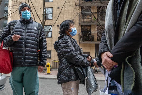 Derek Thompson, left and Anita Quidangen, personal support workers at the multi-lingual, non-profit Rekai Centre nursing home in Toronto, after they received the first Covid-19 vaccines in Ontario, on Monday.