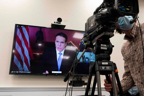 Gov. Andrew M. Cuomo of New York on Monday. A healthcare worker in Queens was vaccinated at Long Island Jewish Medical Center in Queens on Monday.