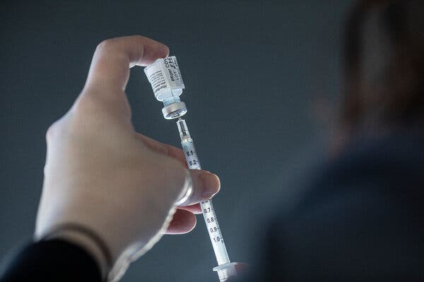 The vaccine made by Pfizer and its German partner, BioNTech, being prepared for use at the University of Iowa Hospital in Iowa City on Monday.