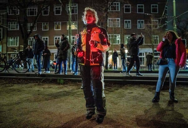 People blew whistles as they demonstrated outdside the Dutch prime minister’s office as he announced a five-week lockdown to slow the spread of coronavirus.