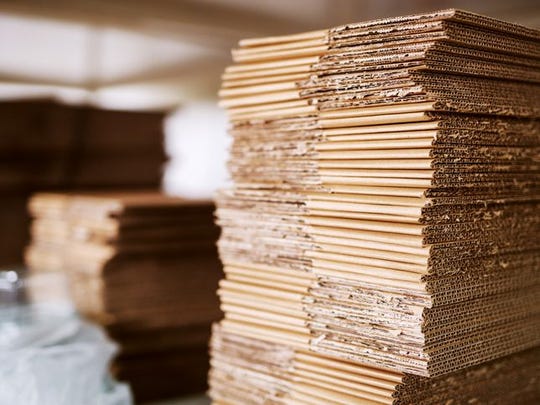 A pile of flat cardboard boxes.