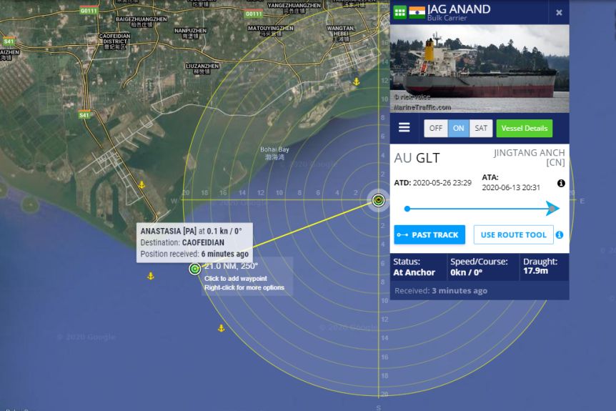 You view a satellite map of the Chinese coast with two dots showing stranded vessels, with an inset picture of one of them.