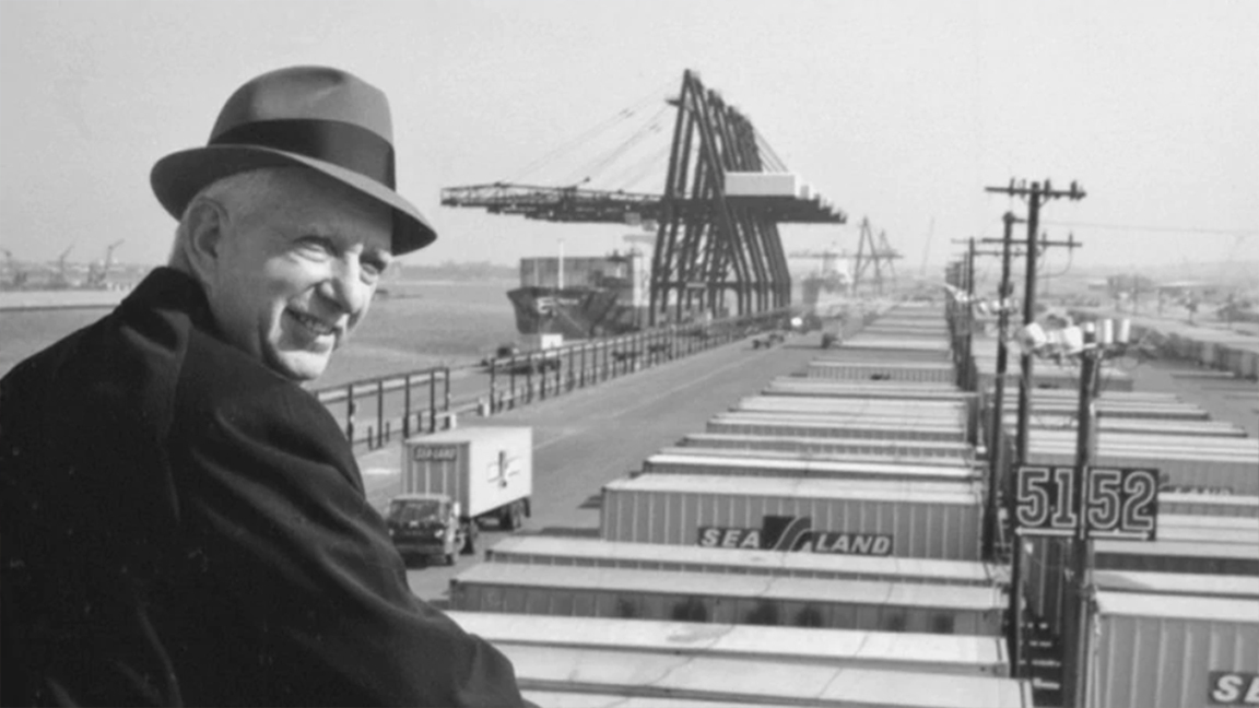Malcom McLean shown dockside above Sea-Land containers. A.P. Møller - Mærsk purchased Sea-Land in 1999.
(Photo: americanbusinesshistory.org)