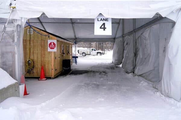 Winter weather has forced some testing sites, like this one in Lawrence, Mass., to temporarily close. And some will limit their hours on Christmas.