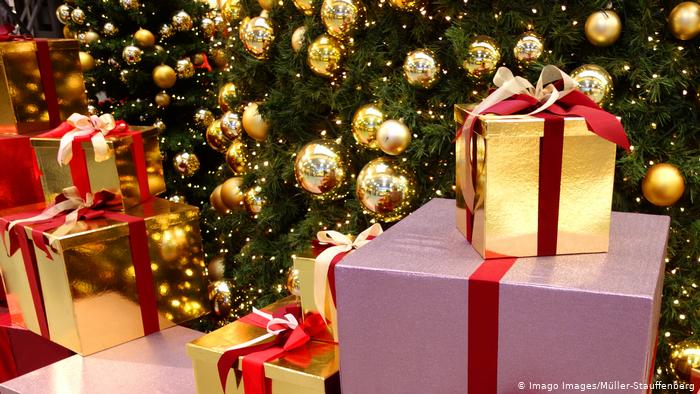 Christmas presents sat around a Christmas tree