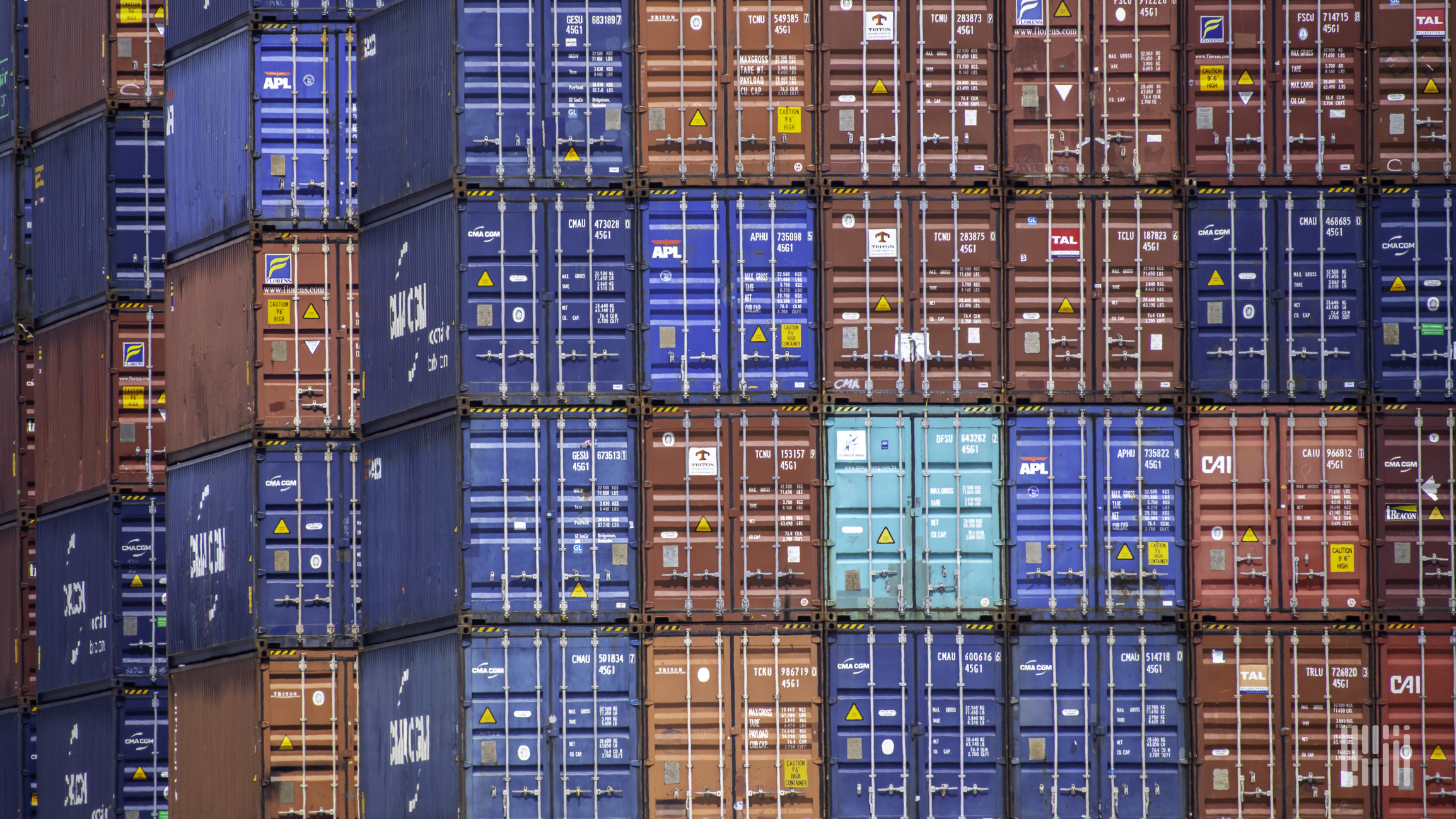 Shipping containers stacked at a port to illustrate Descartes Systems third quarter financial results