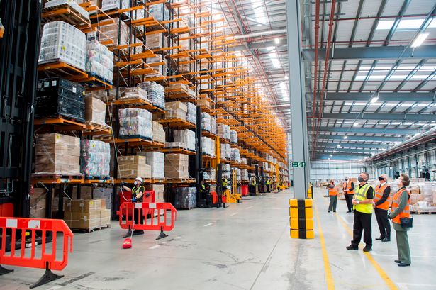 Taking in the height: Princess Anne tours Arco's National Distribution Centre following the £25 million expansion.