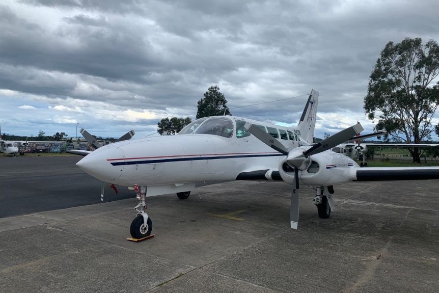 A Par Avion plane ready for take-off at an airport.