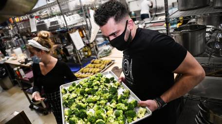 Chef Ryan Carroll prepares meals alongside sous chef