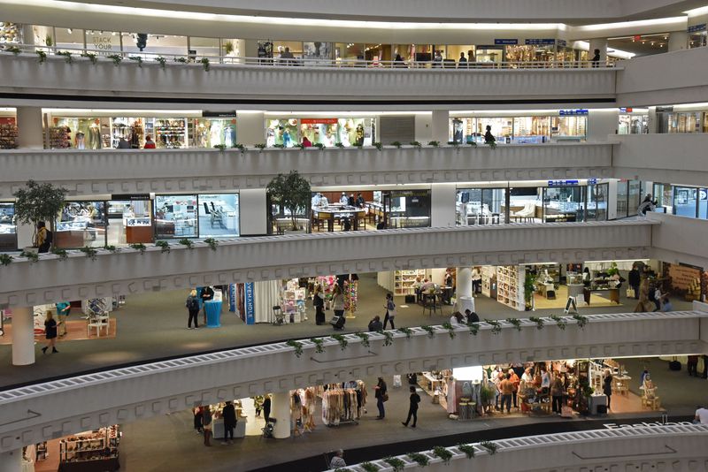 Shop owners and retail buyers roam Building 3 of AmericasMart in downtown Atlanta on Wednesday. Buyers use the annual January Atlanta Market to visit wholesalers and stock up on everything from patio furniture to home decor for the coming year. This year's crowd is smaller than normal because of the coronavirus. (Hyosub Shin / Hyosub.Shin@ajc.com)
