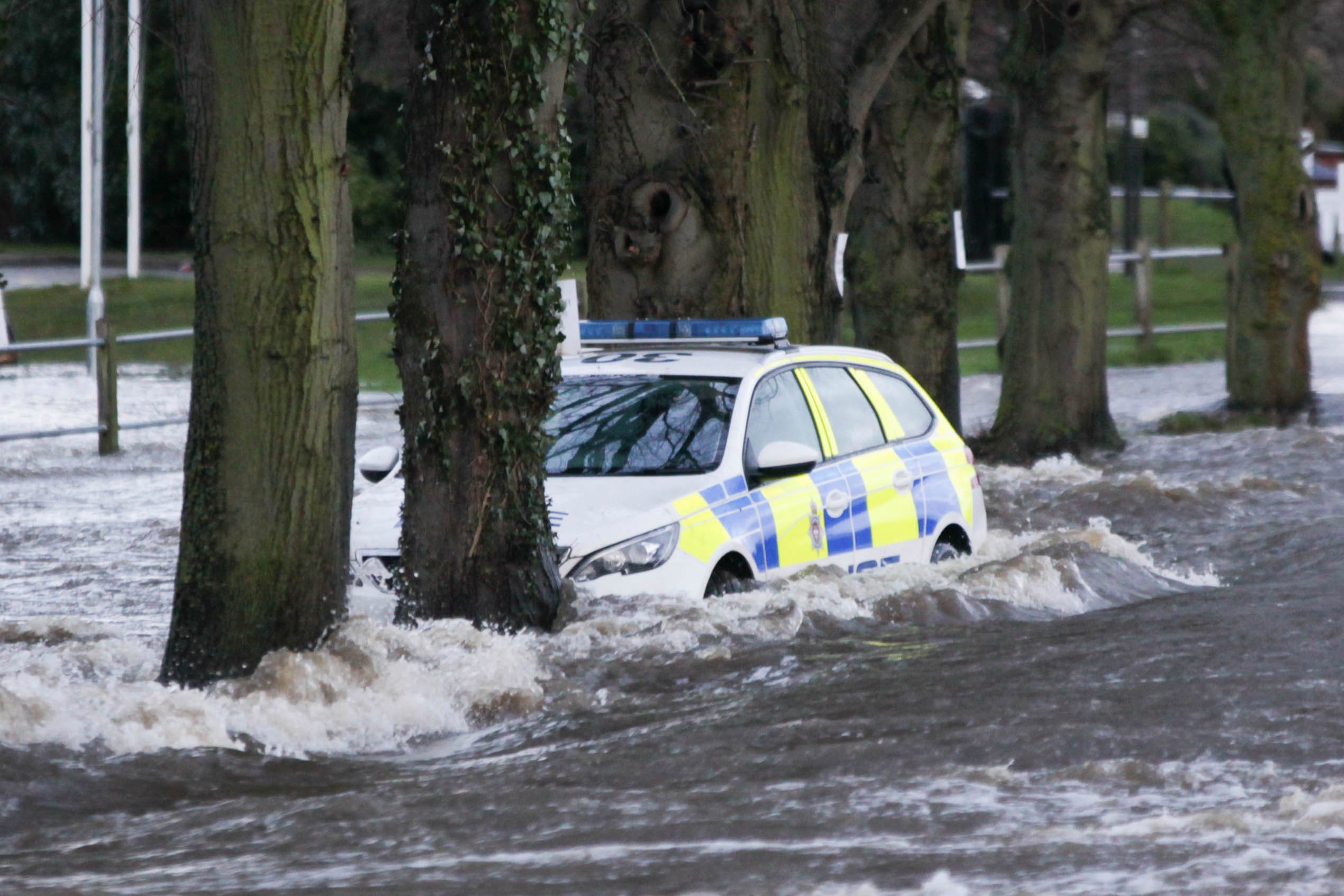 A Derbyshire police car was abandoned in flood water after a major incident was declared in the region following heavy rainfall