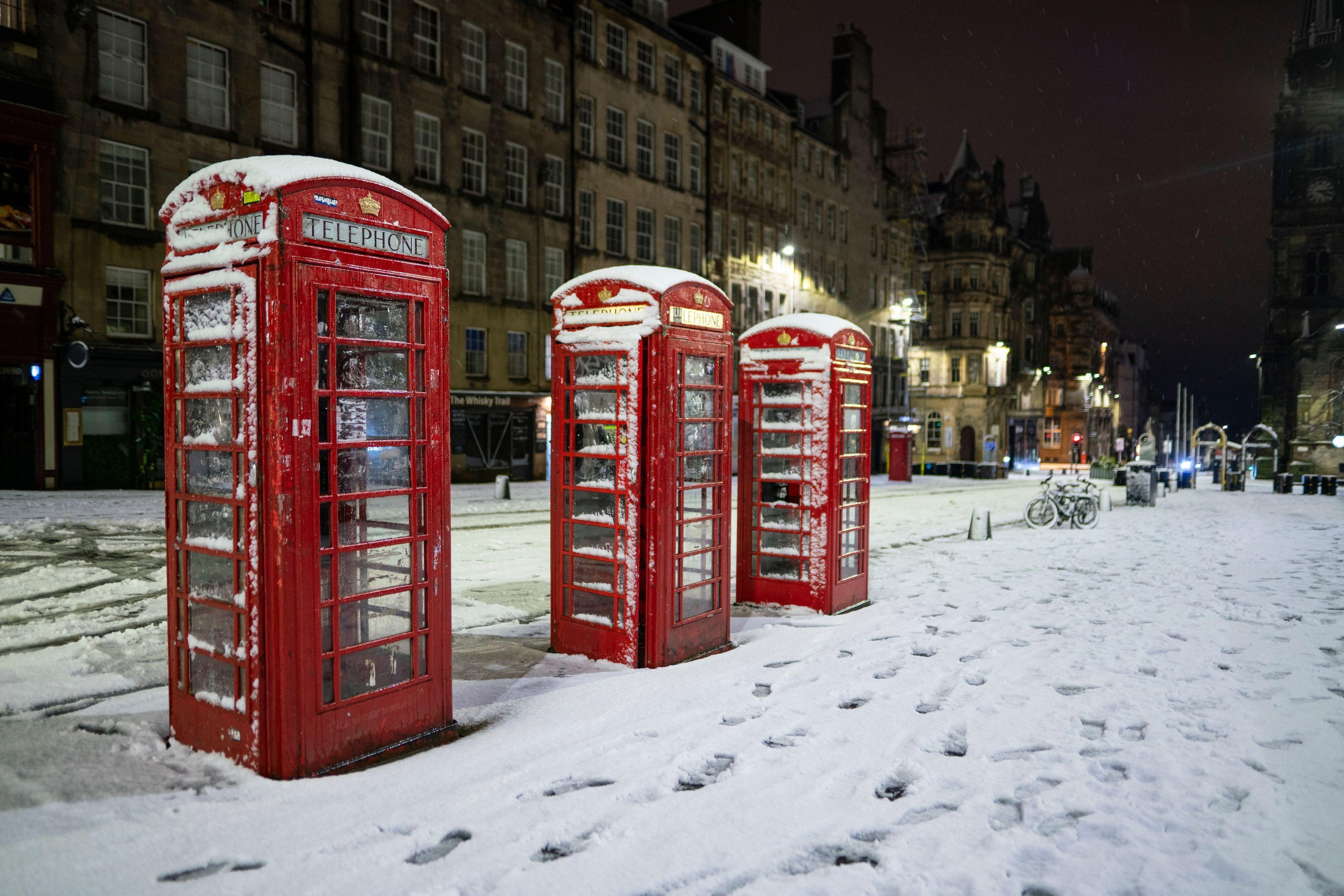 Edinburgh city centre is seen blanketed by snow this morning following heavy snow overnight