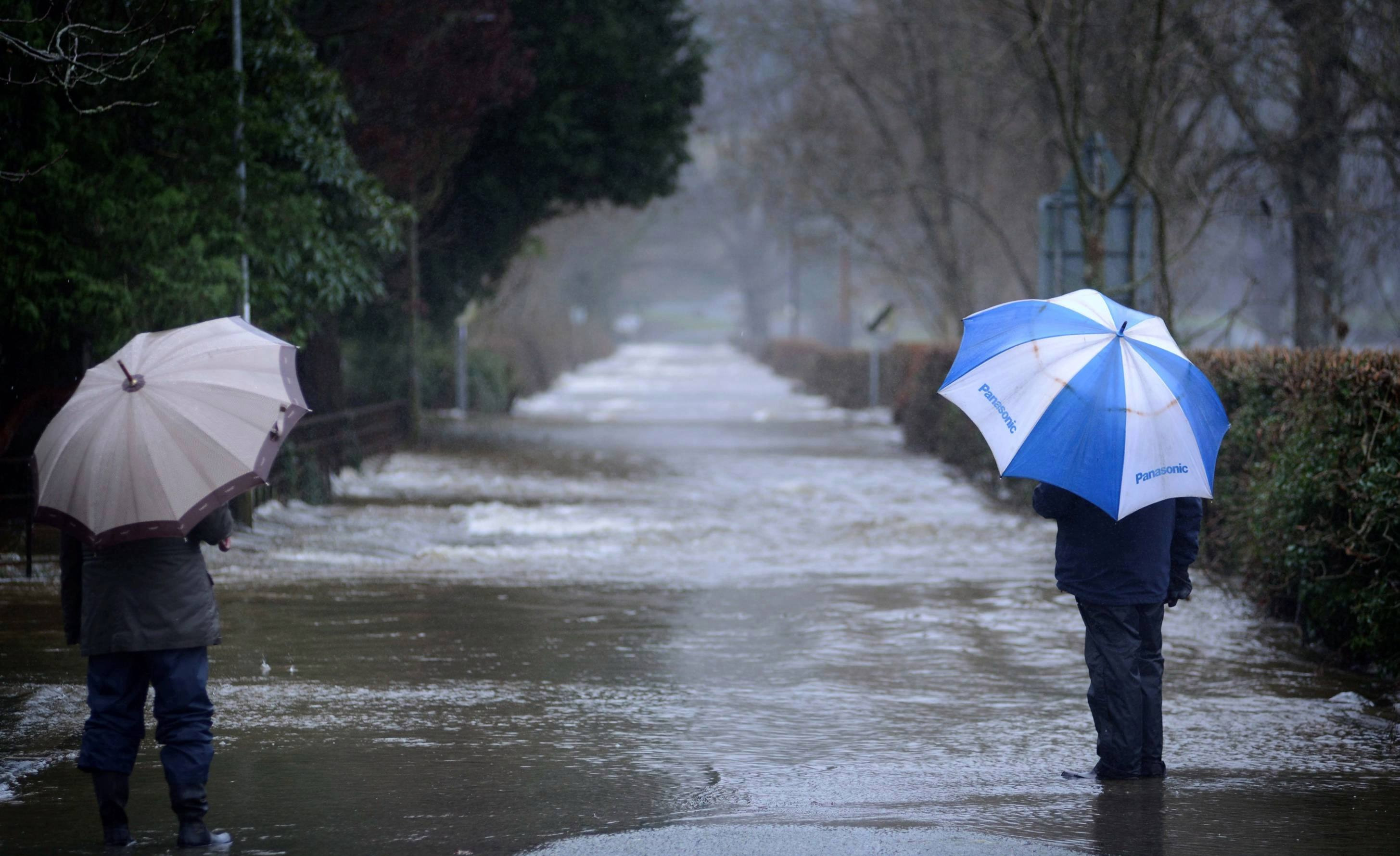 A road in Llanrwst, North Wales, looks more like a rivet yesterday after the River Conwy burst its banks