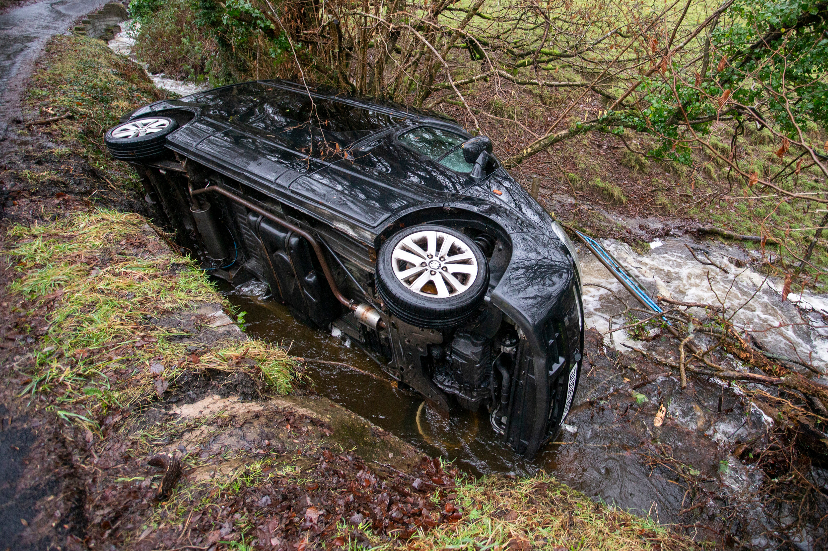 Storm Christoph caused the driver of this van to veer off course and into a stream in Mountain Ash, South Wales yesterday