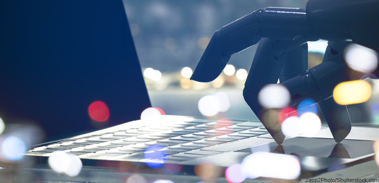robot typing on laptop (Zapp2Photo/Shutterstock.com)
