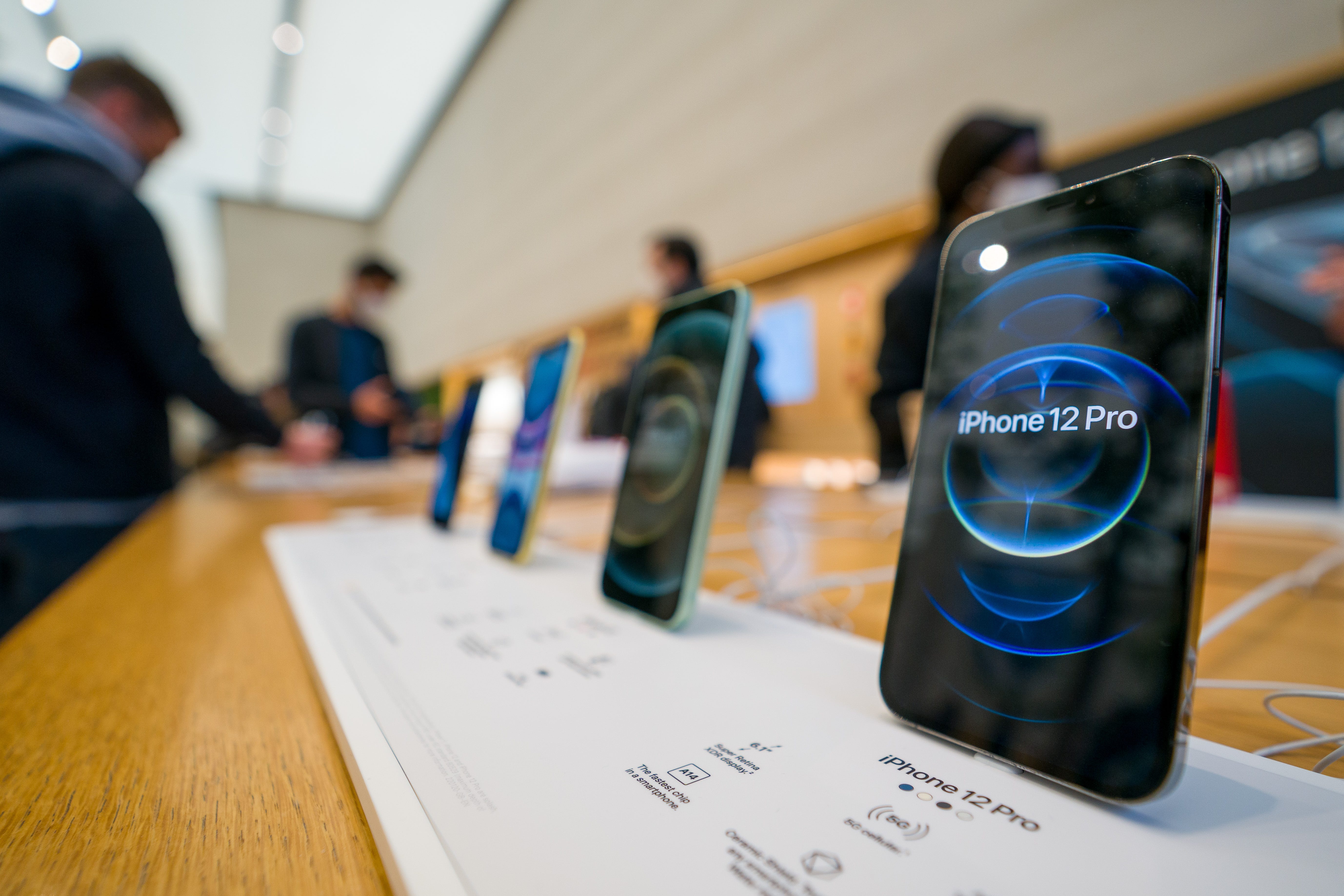 The new iPhone 12 and iPhone 12 Pro on display during launch day on October 23, 2020, in London, England. Apple's latest 5G smartphones go on sale in the UK today. The iPhone 12 Mini and iPhone 12 Pro Max will be available from November 13. (Ming Yeung/Getty Images/TNS)
