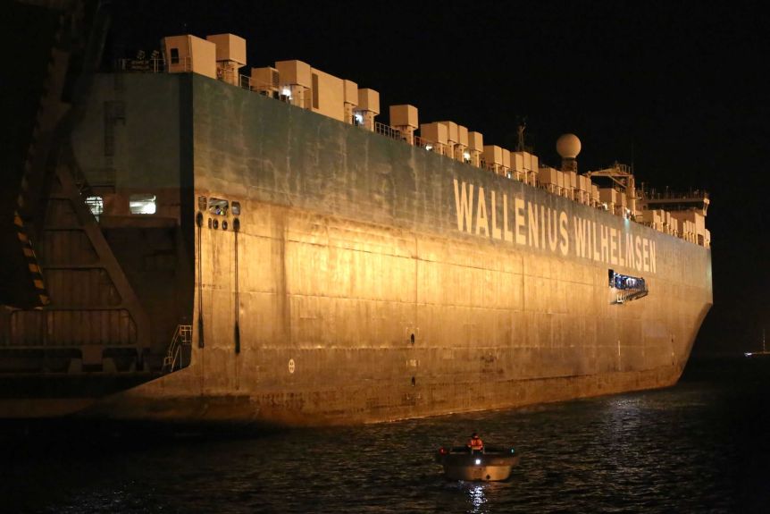 A container ship at night.
