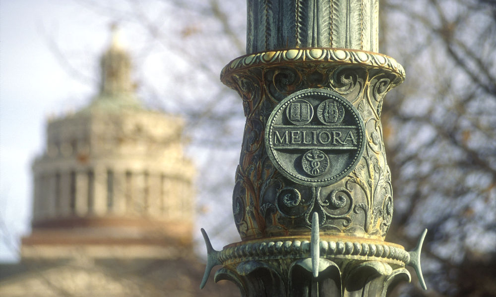 photo of Meliora flagpole and Rush Rhees tower