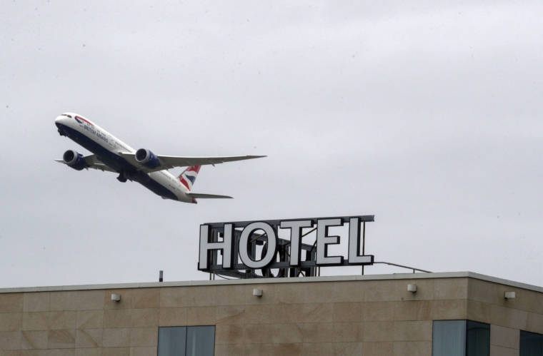 A plane passes over the Sofitel Hotel at Heathrow. Prime Minister Boris Johnson is expected to approve plans to force some travellers arriving to the UK to quarantine in hotels to limit the spread of new coronavirus variants. Picture date: Tuesday January 26, 2021. PA Photo. The Prime Minister will discuss the proposals at a meeting of the Covid-O committee with senior ministers who are considering the measure in a bid to combat the spread of coronavirus variants, such as strains discovered in Brazil and South Africa. See PA story HEALTH Coronavirus. Photo credit should read: Steve Parsons/PA Wire