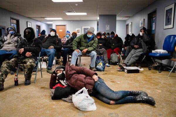 In Kansas City, Mo., where temperatures fell below zero, people tried to stay warm at the headquarters of Street Medicine Kansas City, a nonprofit organization that assists the homeless.