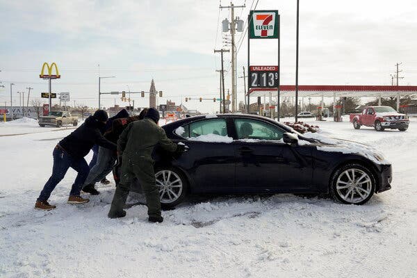 The storm is snarling travel across a wide region. People on Oklahoma City pitched in on Monday to help a stuck motorist.