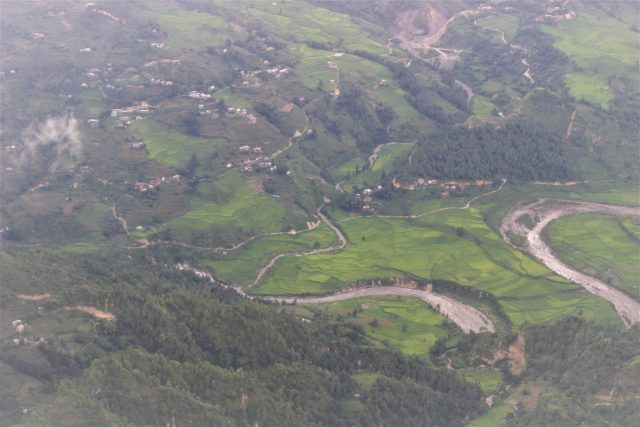 Scattered settlements at the foothills of the Himalayas with a glacier-fed river meandering close in Nepal. Credit: Manipadma Jena/IPS