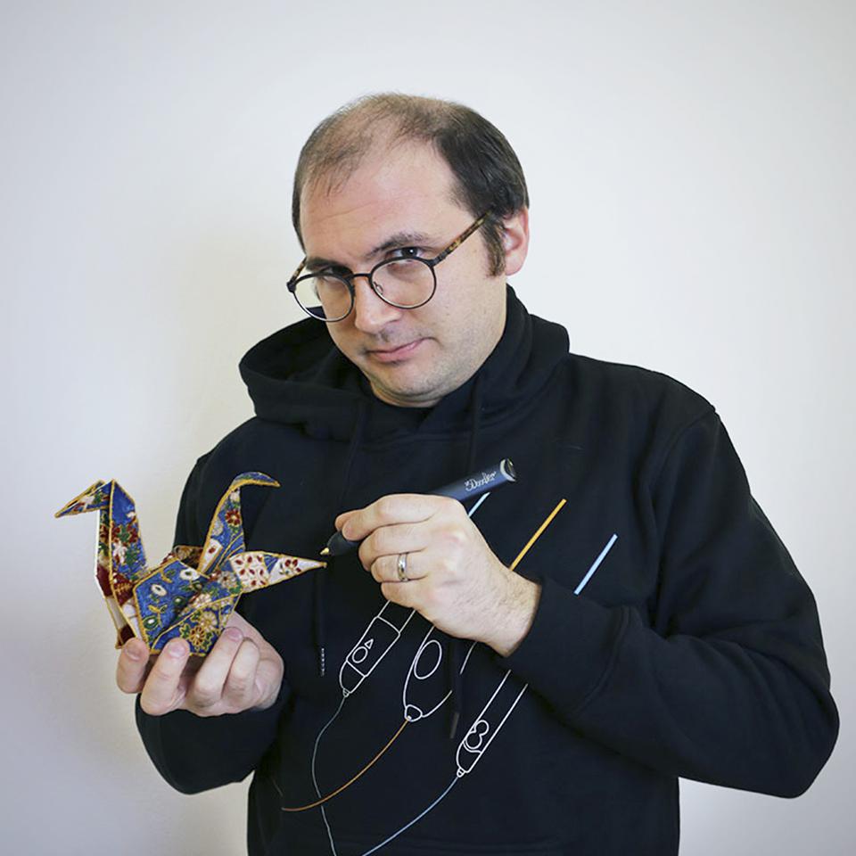 3Doodler Co-Founder and CTO Maxwell Bogue draws on a design with a 3D pen