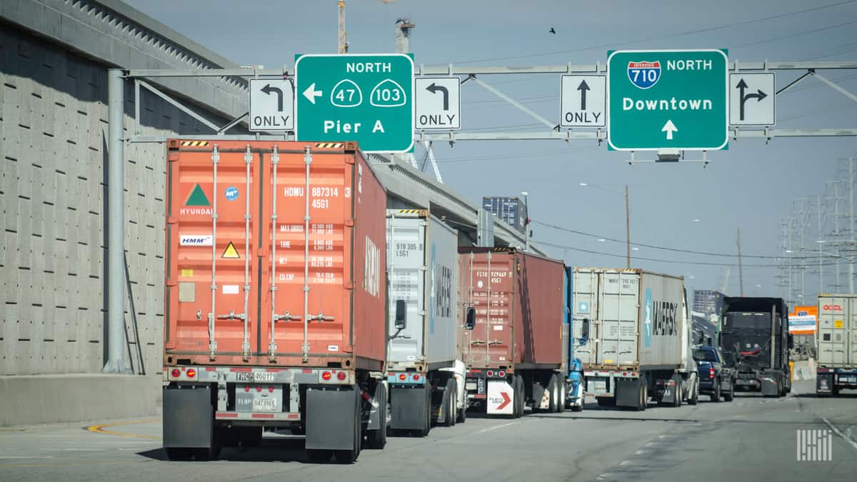 This photo shows trucks exiting a Southern California port complex. Note signs for I-710 (a spur of I-10) and California state routes as well. (Photo: Jim Allen/FreightWaves)