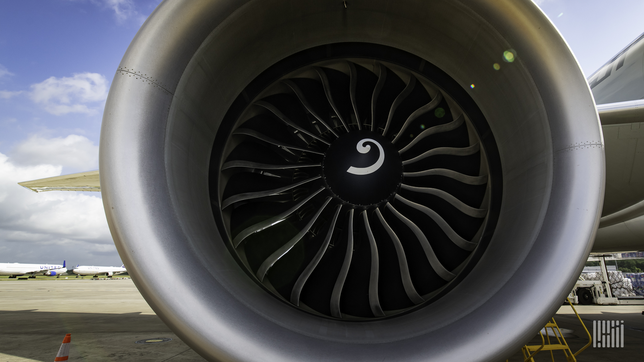 Close up of an aircraft engine staring into the front end.